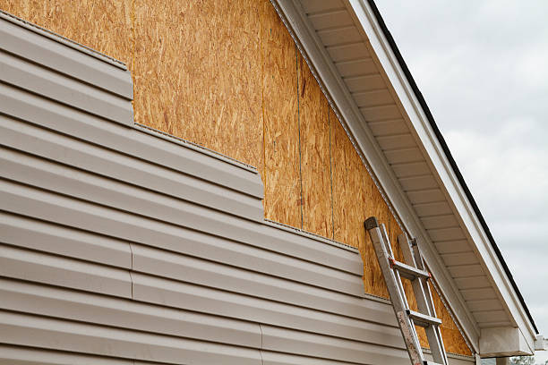 Professional Siding Installation technician working in Clayton, NC